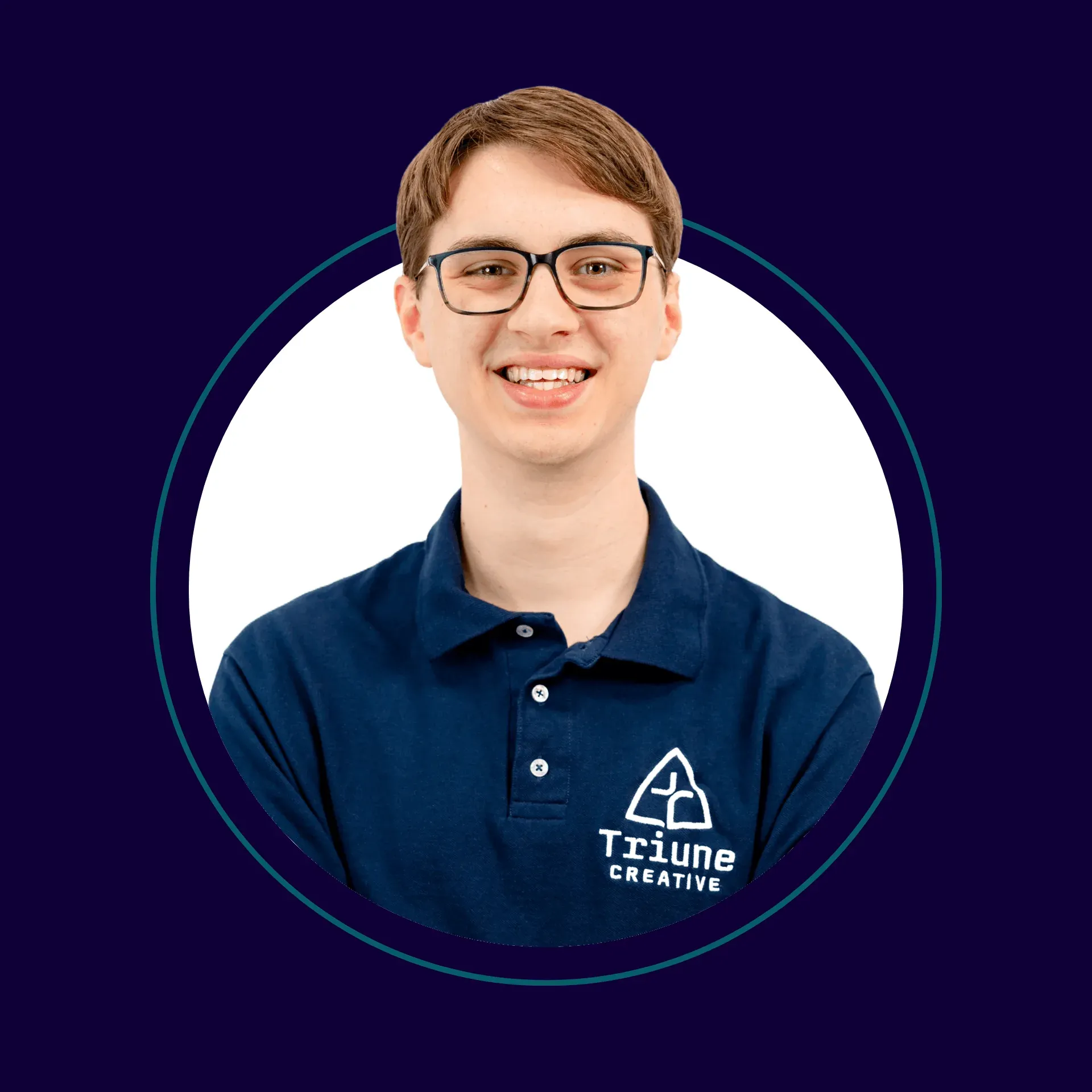 Smiling young person with glasses wearing a navy blue polo shirt with a Triune Creative logo, against a white background with a dark purple border.